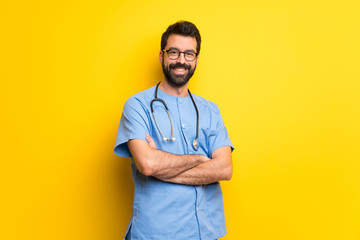 Surgeon doctor man keeping the arms crossed in frontal position