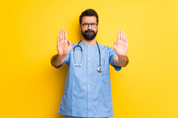 Fototapeta Surgeon doctor man making stop gesture for disappointed with an opinion obraz
