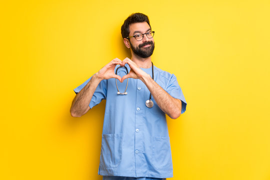 Surgeon doctor man making heart symbol by hands