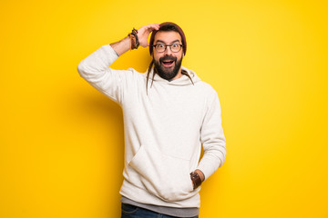 Fototapeta premium Hippie man with dreadlocks with surprise and shocked facial expression