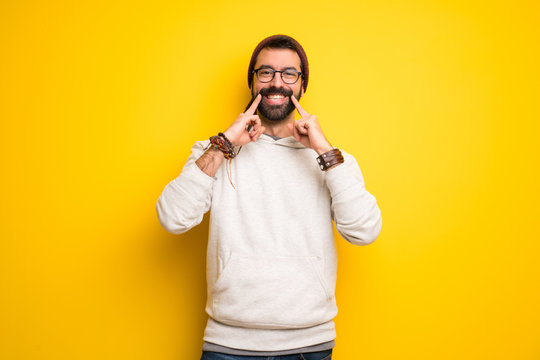 Hippie man with dreadlocks smiling with a happy and pleasant expression