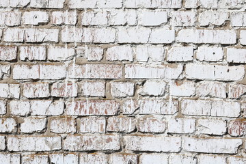 Old wall made of red brick, painted white in loft style for modern designer interior of room, bar or restaurant