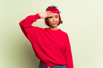 Young woman with red sweater with tired and sick expression