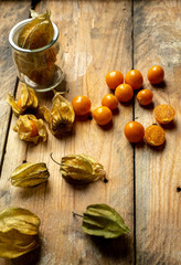 sweet, orange fruit and physalis flowers