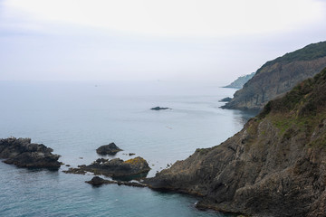 ships in the sea in a foggy day