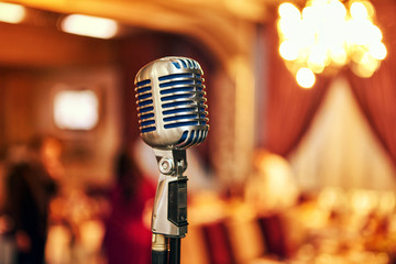 A microphone on stage in a pub or American Bar(Restaurant) during a night show.