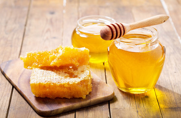 jar of honey with honeycombs