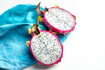 halved pink and green dragon fruit with white flesh