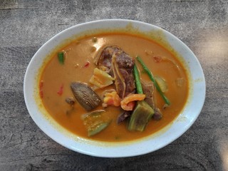 Top view of lamb curry on white bowl.