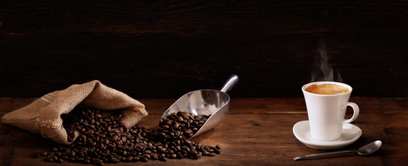 cup of coffee and coffee beans - obrazy, fototapety, plakaty