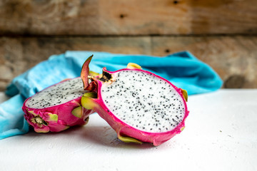 halved pink and green dragon fruit with white flesh