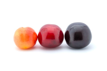 Photo of red cherries isolated on white background