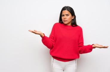 Young Colombian girl with red sweater unhappy for not understand something