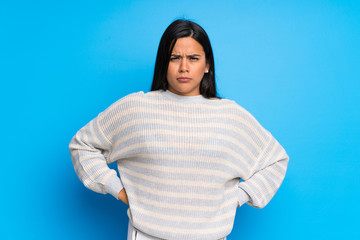 Young Colombian girl with sweater angry