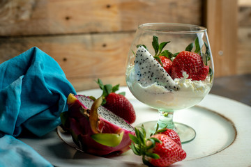 whipped cream with strawberries and dragon fruit