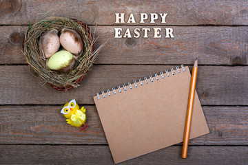 Naklejka premium Easter background. The inscription of the wooden letters 