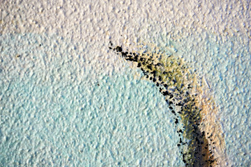 cracked color on a wall outside