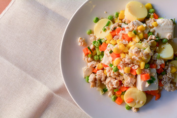 stir-fries egg tofu with minced chicken, pea, and carrot. Healthy food concept