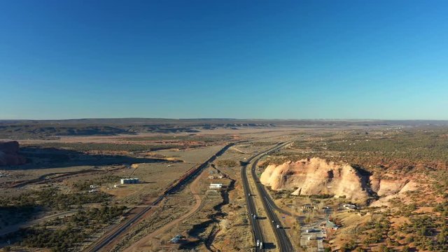 Train running through Arizona western landscape