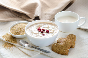 Healthy breakfast. Sesame dry cookies in the form of heart porridge of amaranth with strawberries and yogurt.