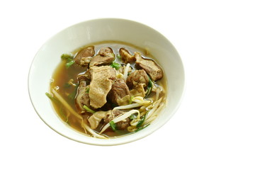 braised pork and bean sprout in brown soup on bowl