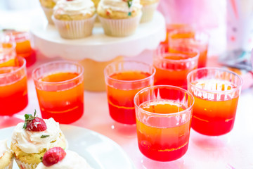 Dessert table with jello and cupcakes Easter party theme