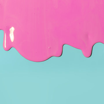pink paint texture on blue canvas. Minimalistic background with copy space. Creative concept.