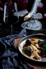 Stewed veal cheeks in red wine, served with mashed potato. Photo for menu.