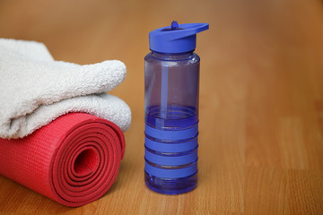 mat towel and bottle of water