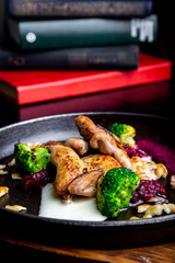 Chicken tobacco in the marinade on a wooden Board.