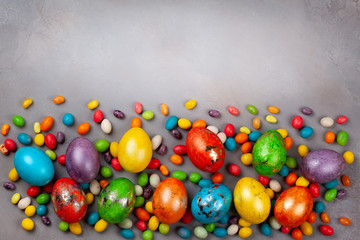 Colorful Easter eggs and chocolate Easter sweets.