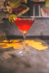 cocktail drinks with smoke on the table.