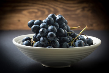 Dark grape in bowl.