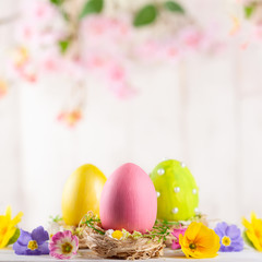 Easter composition with colorful Easter eggs  and spring flowers.