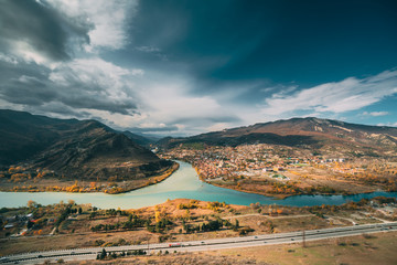 Mtskheta, Georgia. Top View Of Ancient Town Located At Valley Of Confluence Of Rivers Mtkvari Kura And Aragvi In Picturesque Highlands. Autumn Season © Great Brut Here