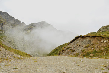 Foggy morning view of Oropa mountain route. Majestic summer scene of Dolomiti Alps, Italy, Europe. Beauty of nature concept background.