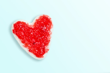 Bread cut into heart shape, made with strawberry jam