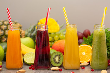 Assortment of fruit and vegetables smoothies in glass bottles. Fresh organic Smoothie ingredients. Detox, dieting or healthy food concept. Vegetarian food.
