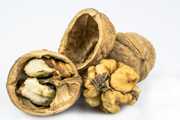 Chopped walnuts, shells, isolated on a white background.