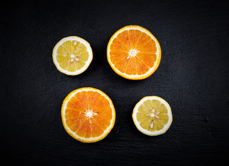 Citrus fruit cut in half oranges and lemons