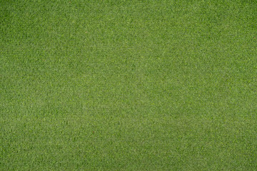 Green artificial grass or fake turf abstract texture.
