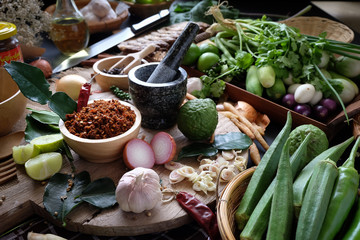 Assortment of Thai food Cooking ingredients. Spices ingredients chilli pepper garlicgalanga and kaffir lime leaves.