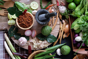 Assortment of Thai food Cooking ingredients. Spices ingredients chilli pepper garlicgalanga and kaffir lime leaves.