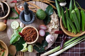 Assortment of Thai food Cooking ingredients. Spices ingredients chilli pepper garlicgalanga and kaffir lime leaves.