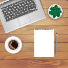 The layout in the style of flat lay: a laptop, a cup of coffee and items on the table