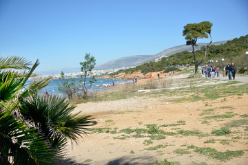 People walkingnear the beach in a sunny day