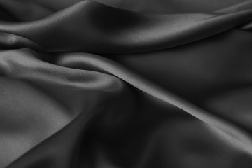 Naklejka na ściany i meble Black luxury wavy rippled glossy silk drapery cloth fabric
