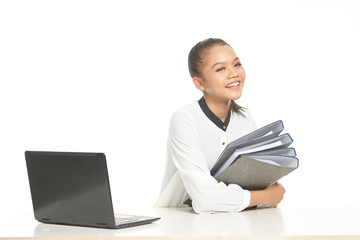 Office lady in white shirt and ponytail hair using a laptop and file