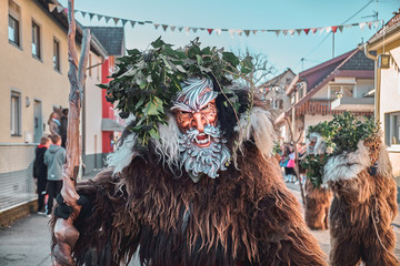Wild man with white beard. Carnival party in southern Germany - Black Forest.