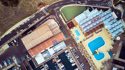 air photo recreation complex with a port pool and tennis court